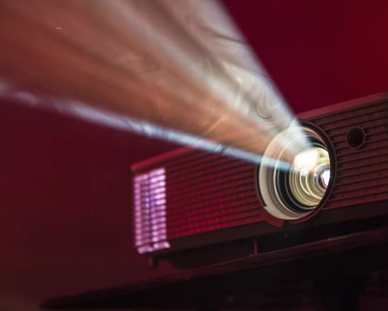 Projector Showing Film in Cinema Room