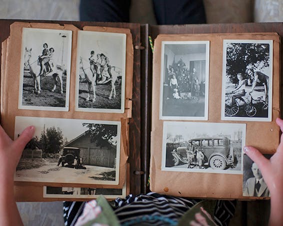 Resident looking at memories in an old photo album