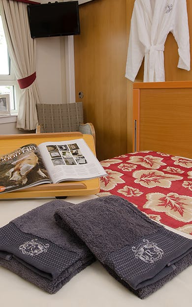 Towels on Bed with Magazine