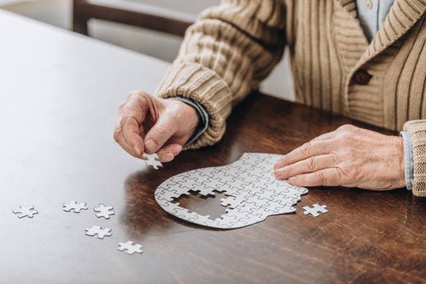 Resident Playing with Puzzle
