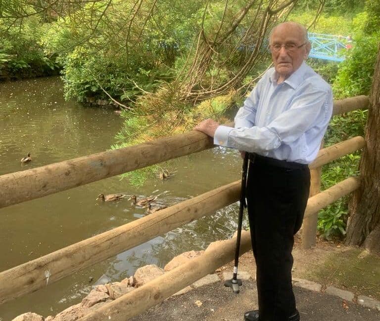 Resident Watching the Ducks When Out in the Local Community