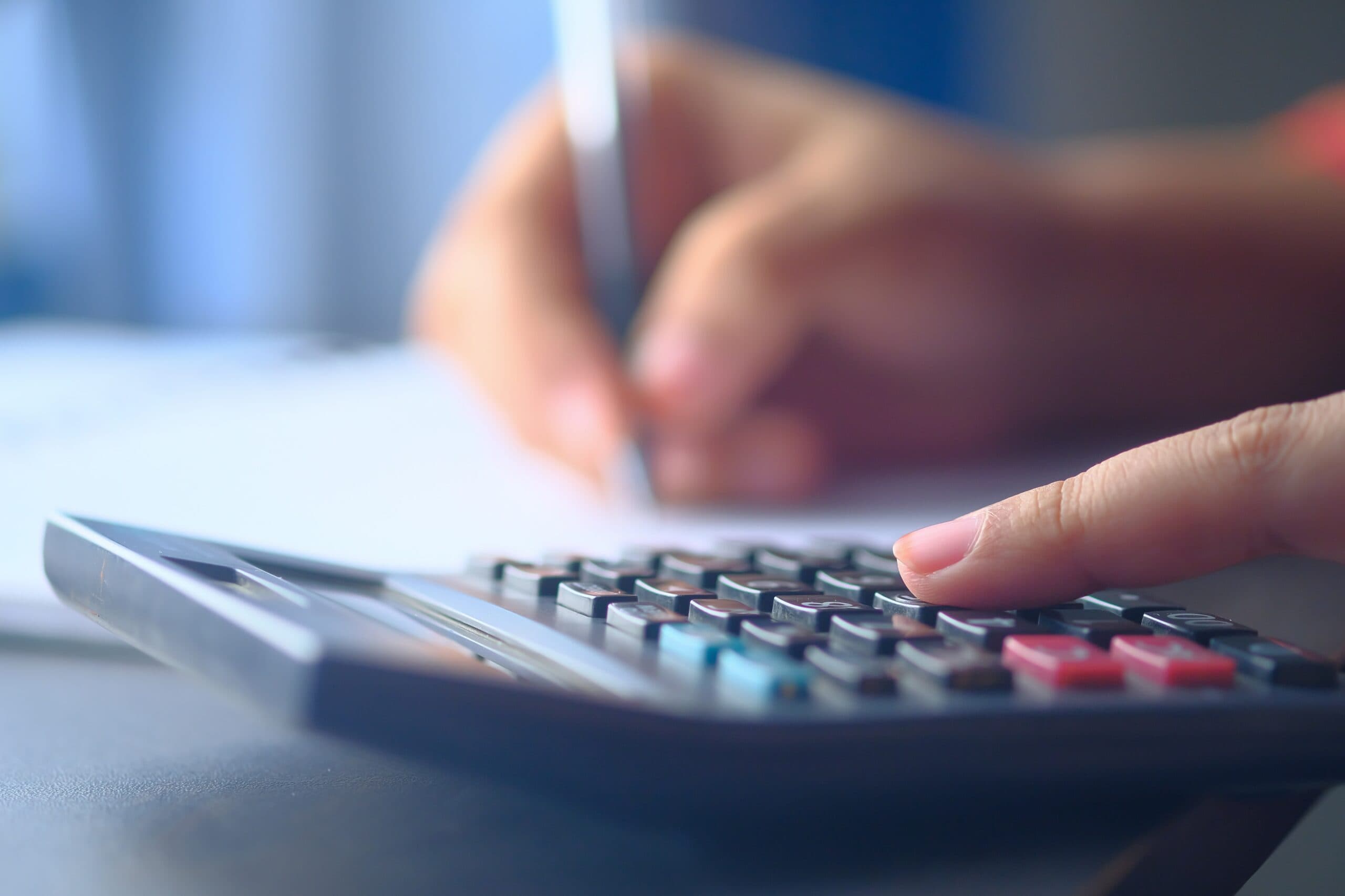 Woman Using a Calculator