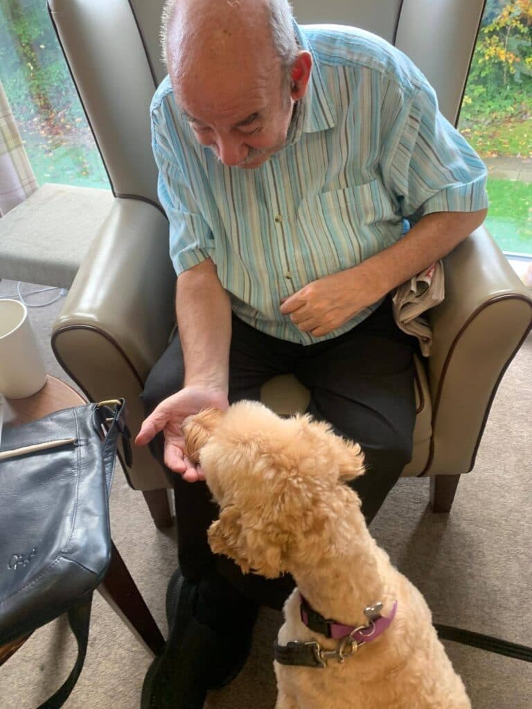 poppy the dog with residents